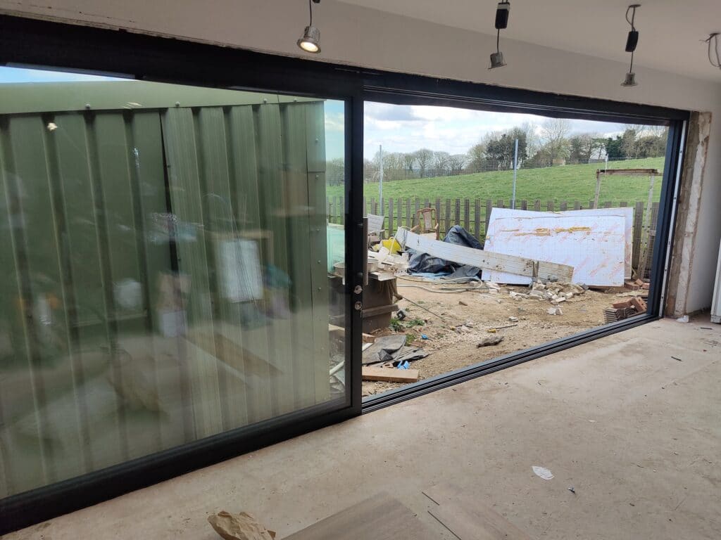 grey patio doors fitted in a new extension