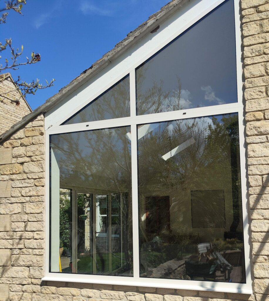 white window beside aluminium French doors in Kings Cliffe house