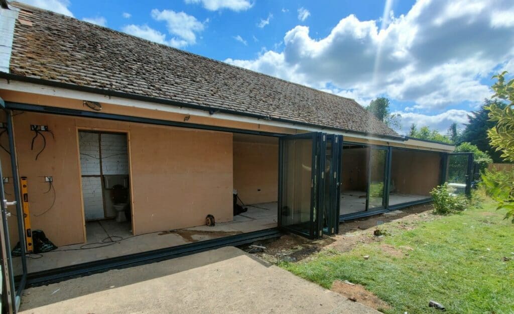 Origin bifold doors in Peterborough to a detached house extension with garden views
