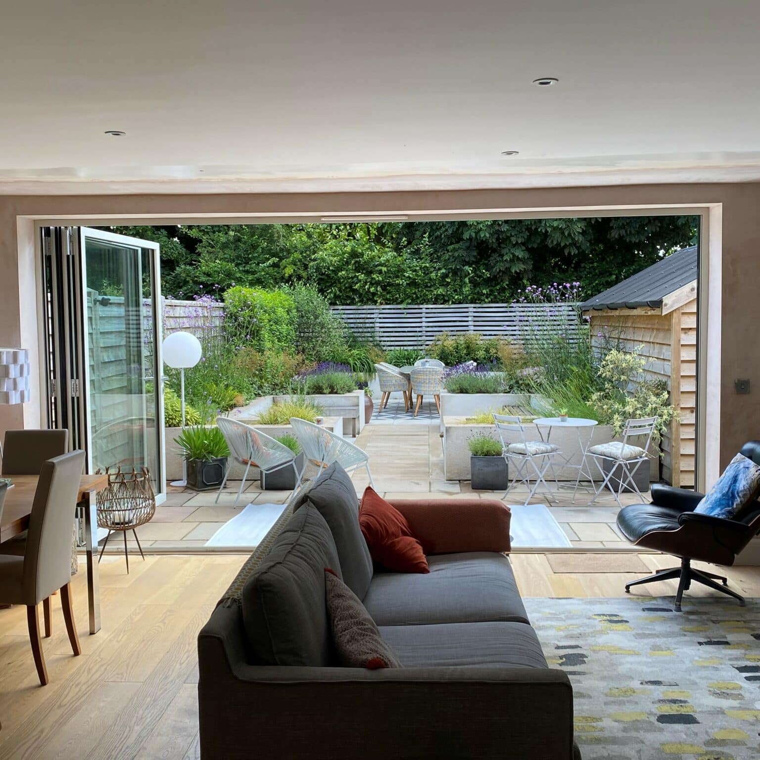 Schuco ASS70 bifolding door fully open with garden view