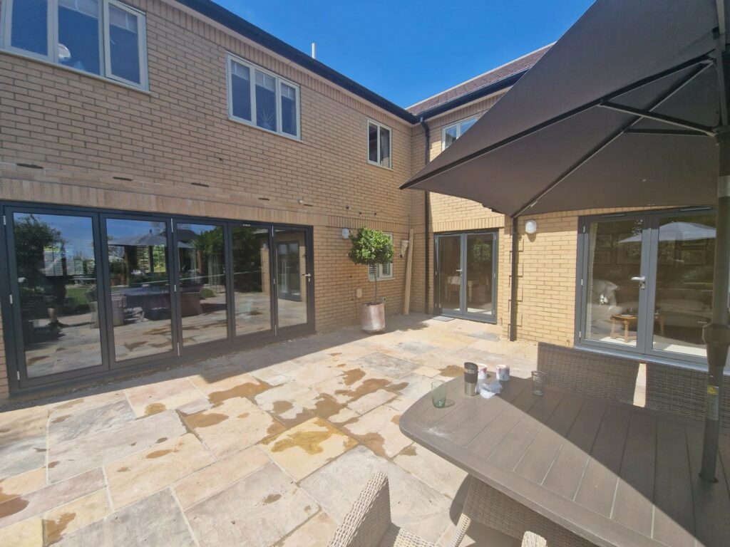 Schüco aluminium doors in a French style in white brick house
