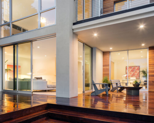ultra slim sliding doors on a wet patio with decking