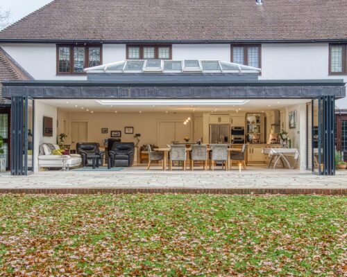 sunflex sf75eco bifold doors in a large extension with lantern roof above.